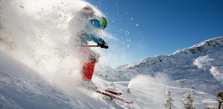 man skiing surrounded by cold snow man skiing surrounded by cold snow