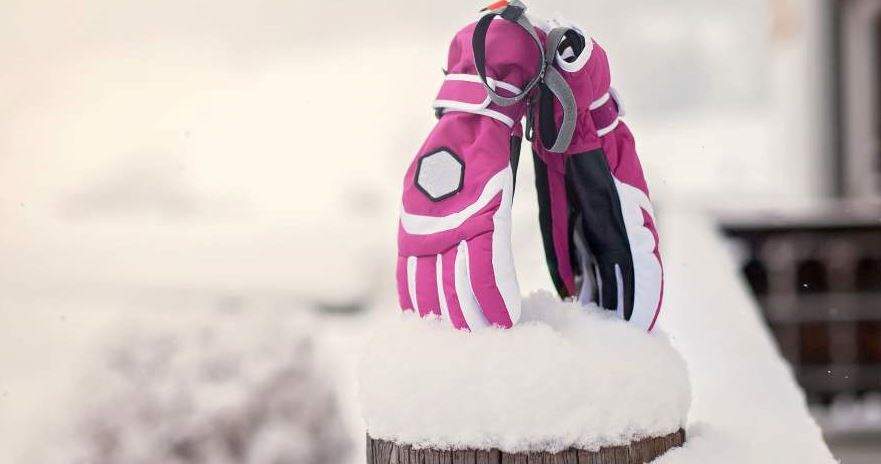 two gloves stuck in the snow two gloves stuck in the snow